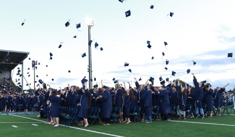 Grads throwing their hats.